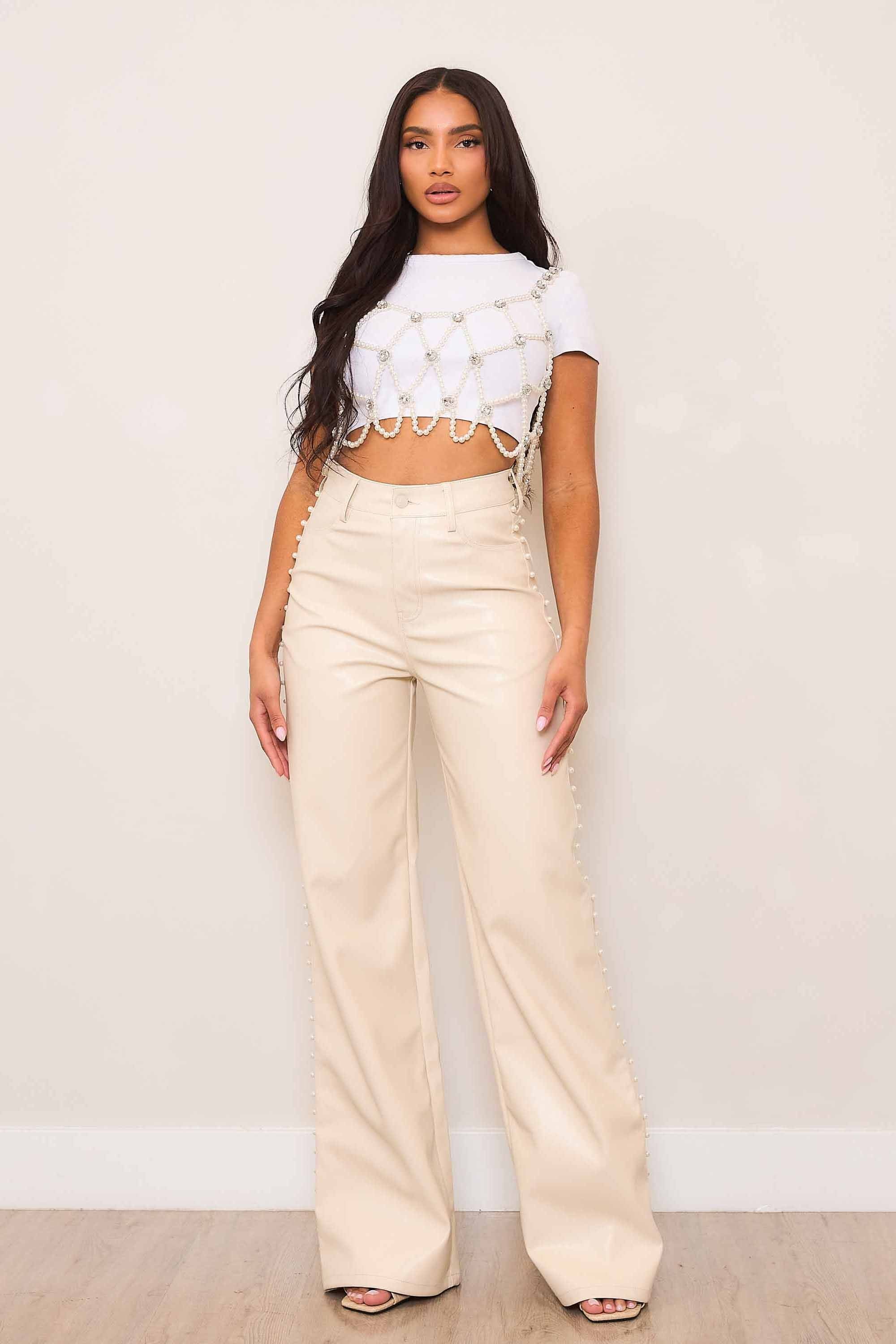 PANTALON ECOCUERO CREMA CON PERLAS